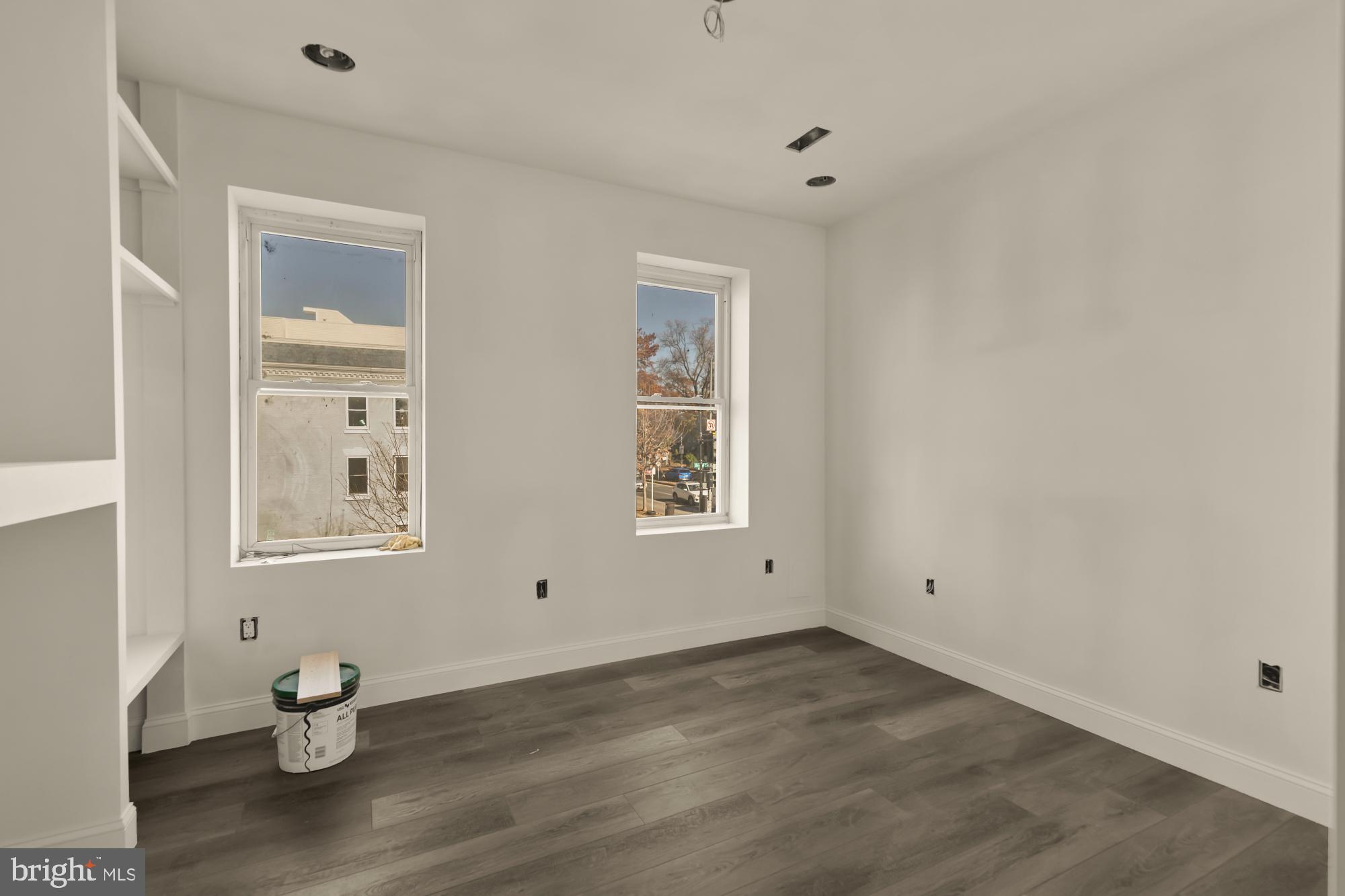 2324 North Capitol Street Northwest Washington, DC 20002 - Photo 23 of 35 a view of an empty room with wooden floor and a window
