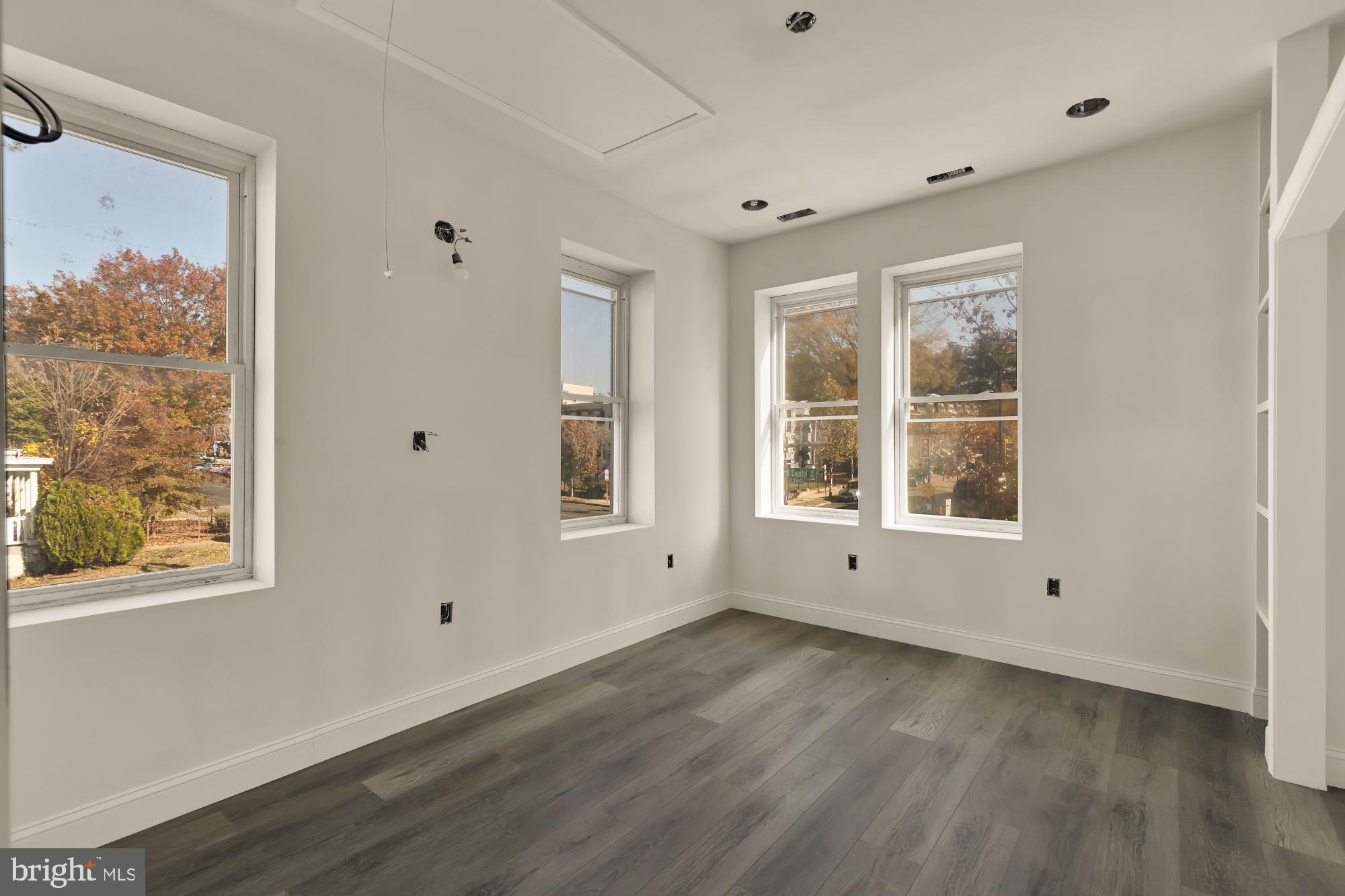 2324 North Capitol Street Northwest Washington, DC 20002 - Photo 25 of 35 a view of empty room with wooden floor and fan