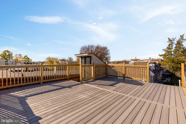 a view of balcony with wooden floor and city view