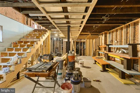 a view of a patio with table and chairs