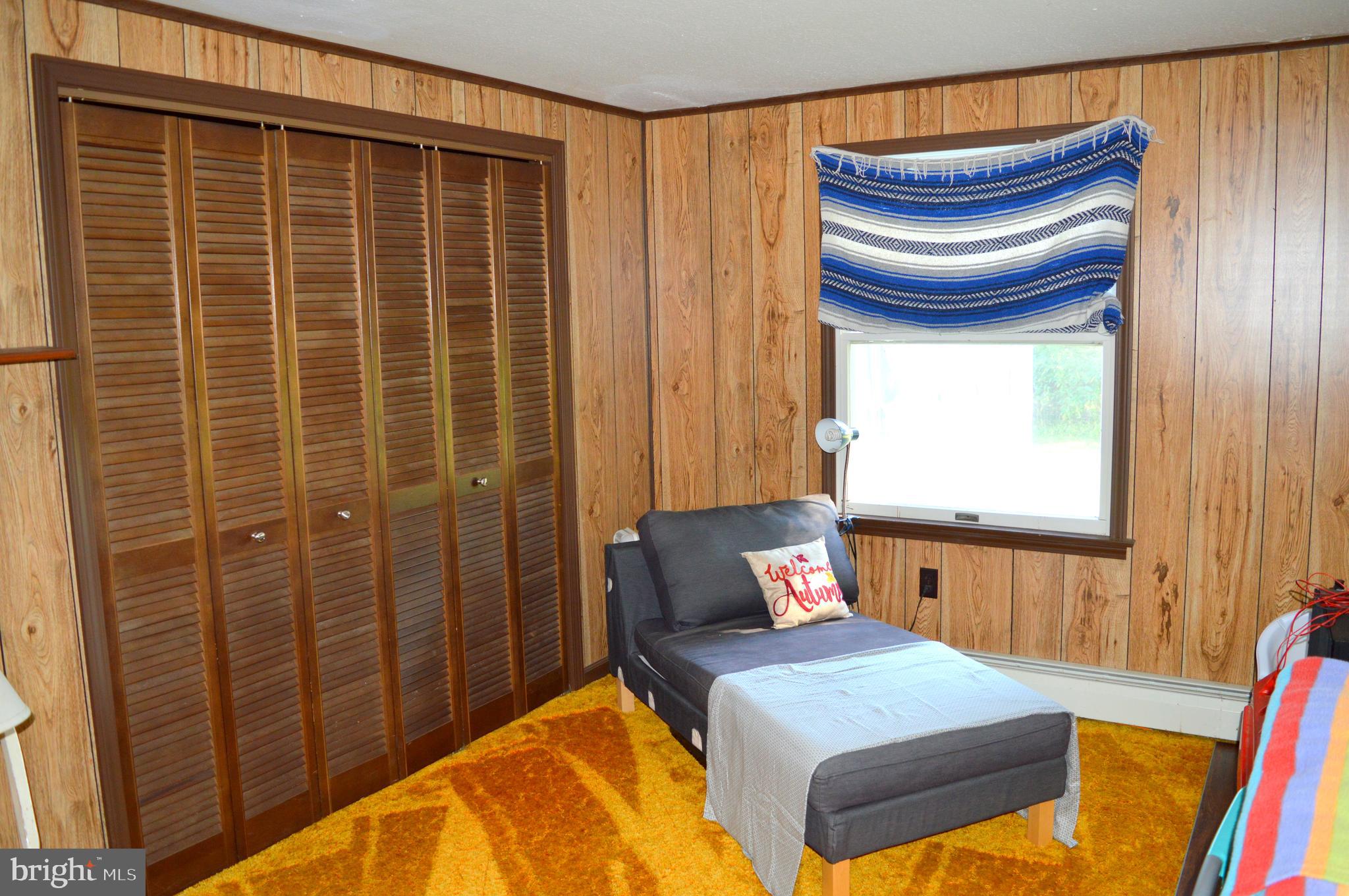 4666 Maiden Forest Road Rhodesdale, MD 21659 - Photo 14 of 17 a bedroom with a bed and a window