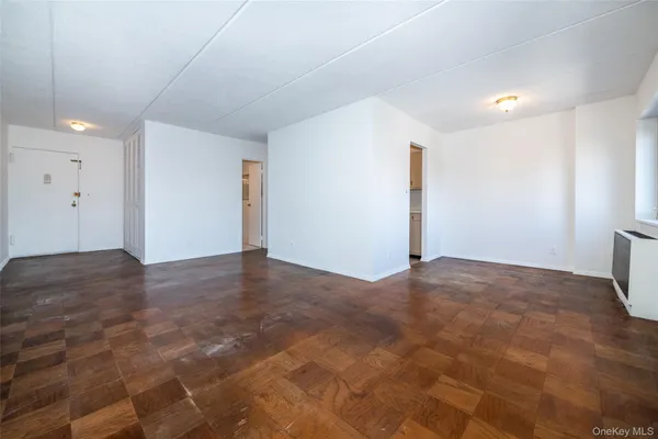 a view of a livingroom with wooden floor