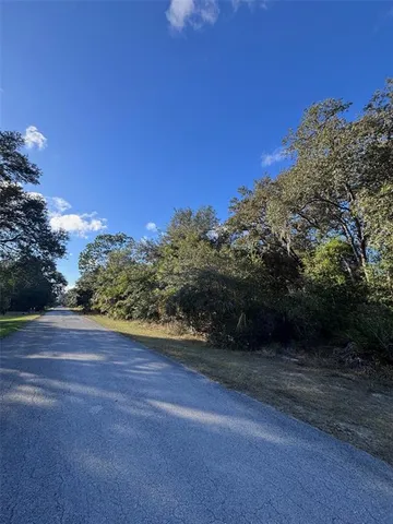 a view of a backyard of the house