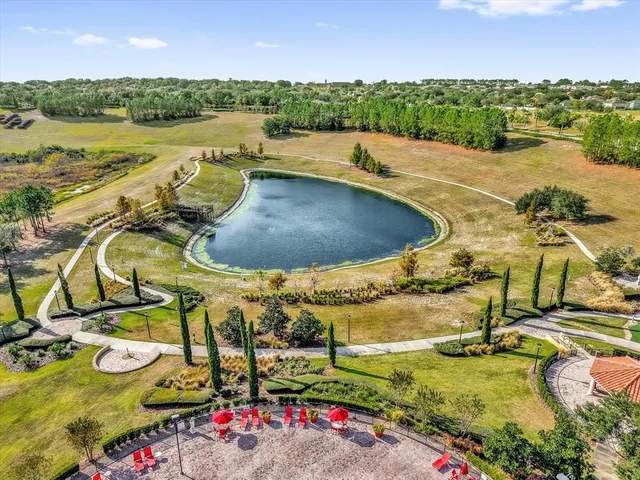 an aerial view of a house with a lake view