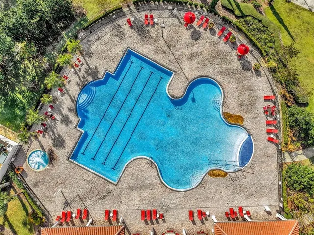 view of a tennis ground with large trees