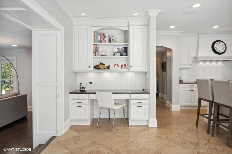 626 Warwick Road Kenilworth, IL 60043 - Photo 14 of 56 a kitchen with stainless steel appliances granite countertop a refrigerator and a stove top oven