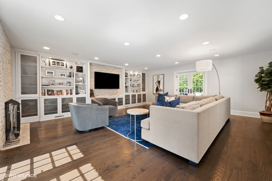 626 Warwick Road Kenilworth, IL 60043 - Photo 17 of 56 a living room with fireplace furniture and a flat screen tv