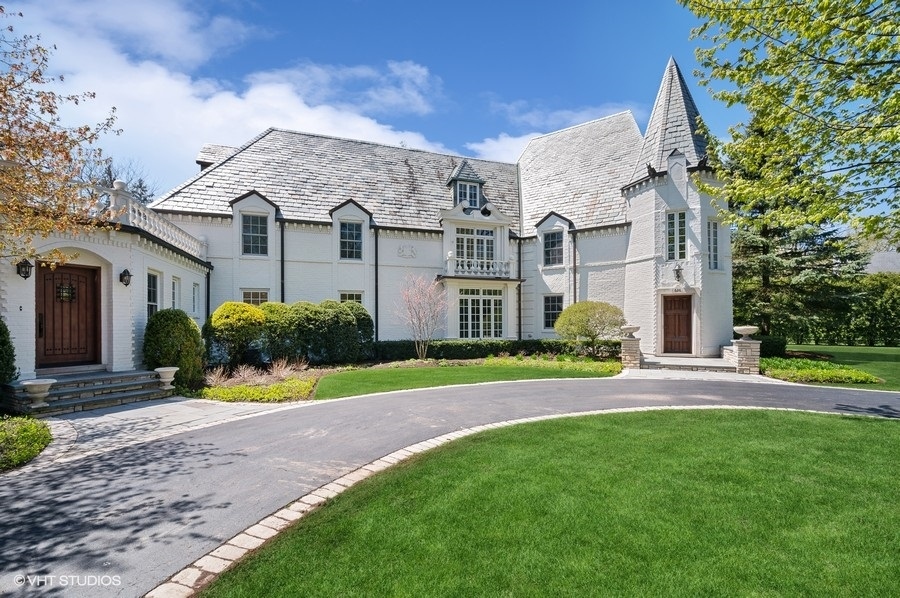 626 Warwick Road Kenilworth, IL 60043 - Photo 2 of 56 a view of a big house with a big yard and large tree