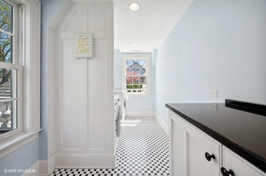 626 Warwick Road Kenilworth, IL 60043 - Photo 30 of 56 a view of a hallway to a bedroom with wooden floor and windows