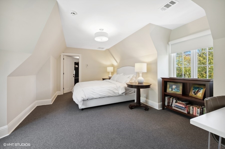 626 Warwick Road Kenilworth, IL 60043 - Photo 33 of 56 a bedroom with a bed a dresser and next to a window
