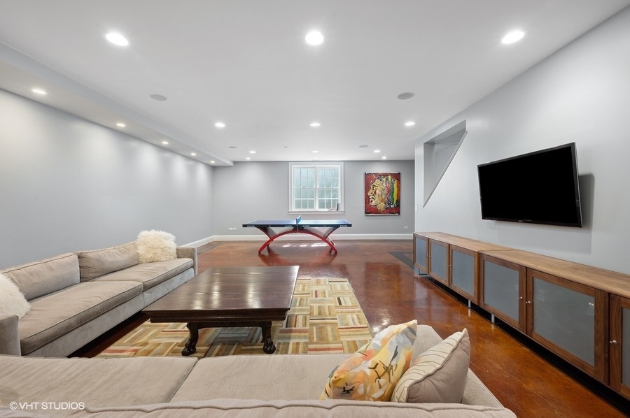 626 Warwick Road Kenilworth, IL 60043 - Photo 34 of 56 a living room with furniture and a flat screen tv