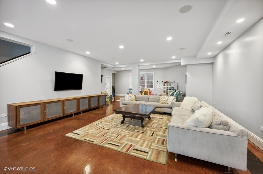 626 Warwick Road Kenilworth, IL 60043 - Photo 35 of 56 a living room with furniture and a flat screen tv