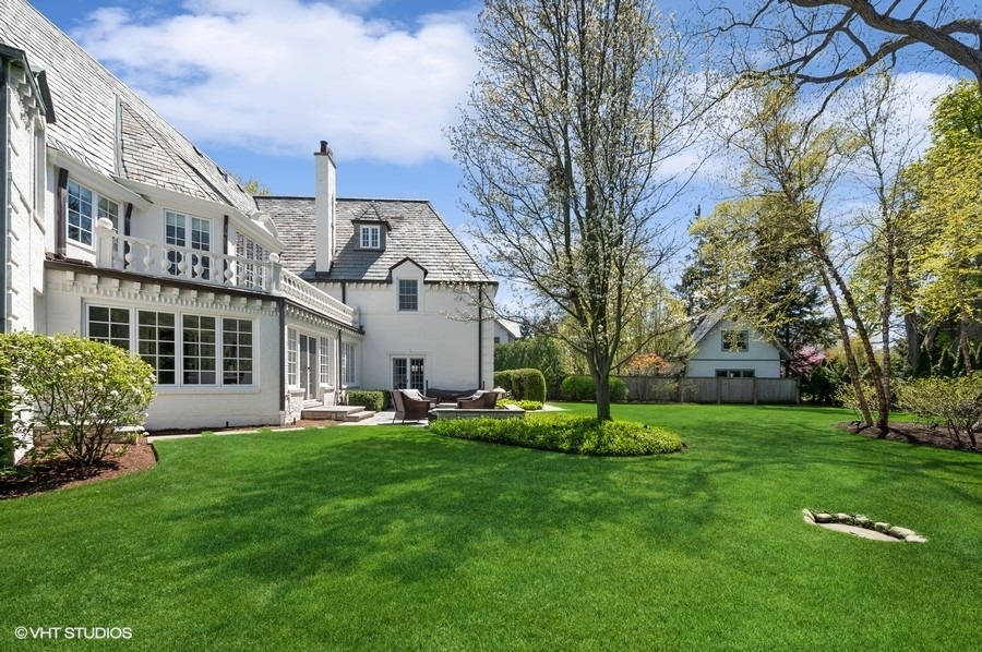 626 Warwick Road Kenilworth, IL 60043 - Photo 38 of 56 a view of a house with a yard and a large tree