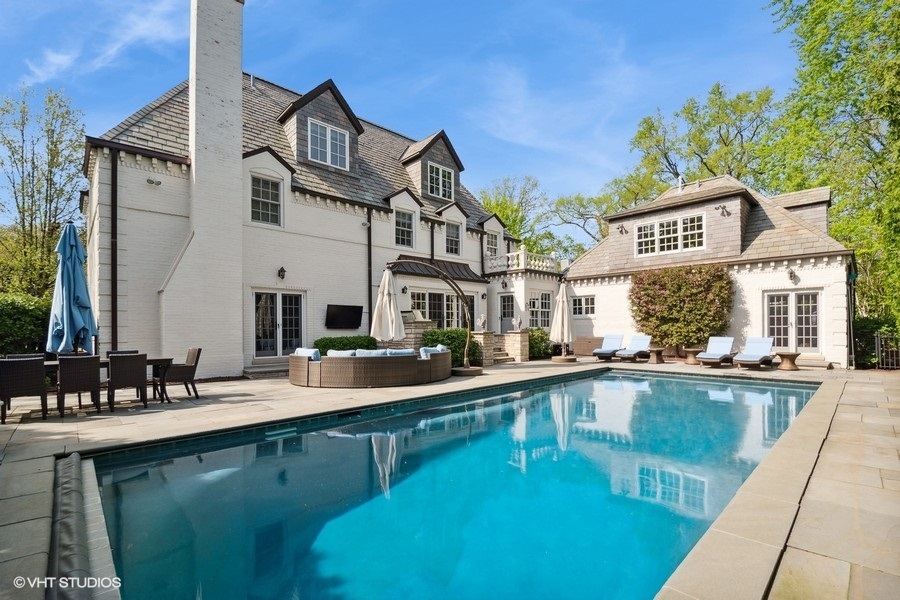 626 Warwick Road Kenilworth, IL 60043 - Photo 44 of 56 a view of a house with a swimming pool
