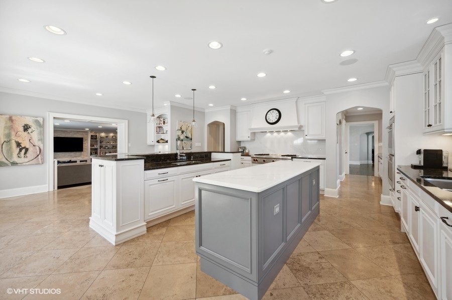 626 Warwick Road Kenilworth, IL 60043 - Photo 10 of 56 a large kitchen with stainless steel appliances a sink a stove and a refrigerator