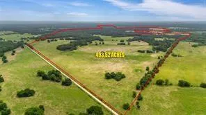 a view of a swimming pool with a lake from a building in the back