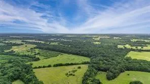 a view of a lake with houses in the back