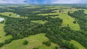 a view of a lake with houses in the background