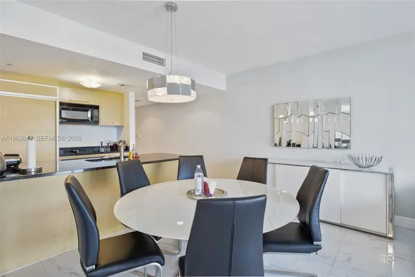 a view of a dining room with furniture