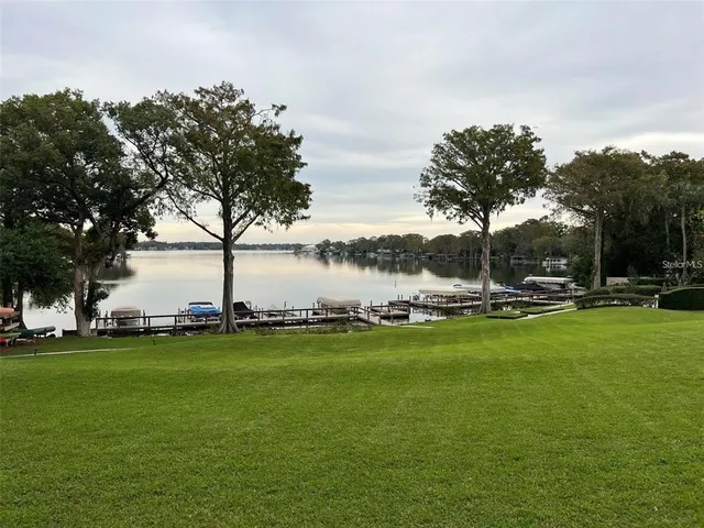 a view of a water fountain and a big yard