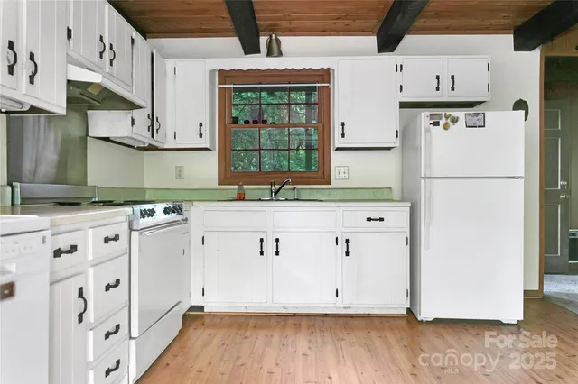 a view of a kitchen with electric appliances