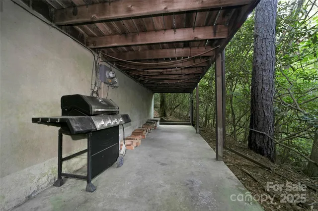 a view of a small house with a yard