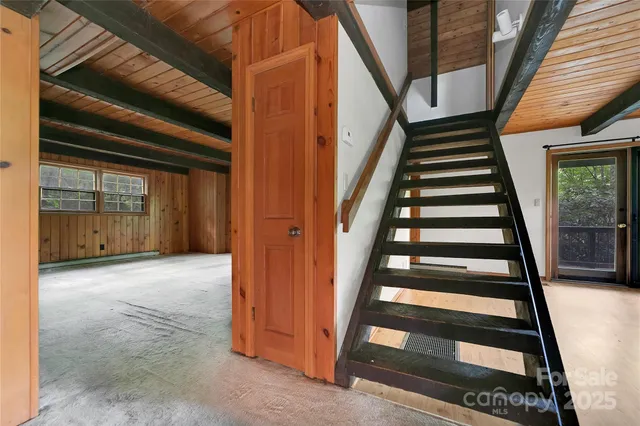 a view of an empty room with a fireplace