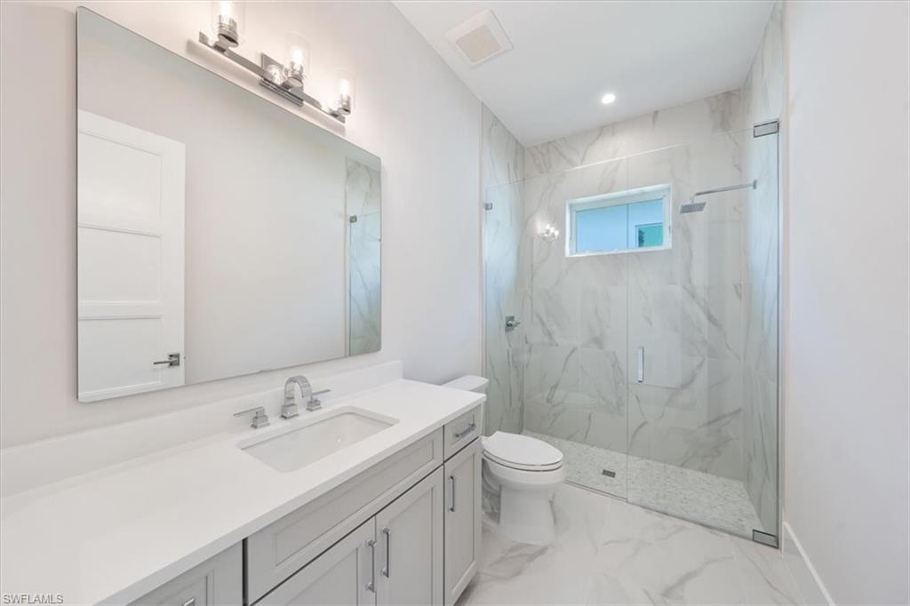 23517 Coconut Road Estero, FL 34134 - Photo 24 of 40 Bathroom 3 is adjacent to bedroom 3 and doubles as a convenient pool bathroom.