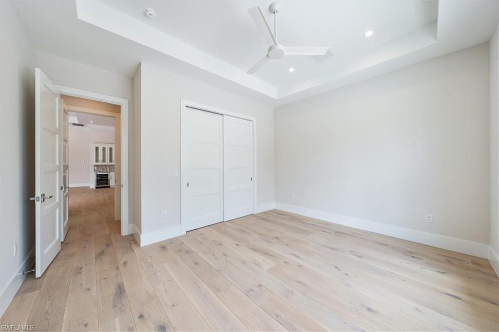 23517 Coconut Road Estero, FL 34134 - Photo 29 of 40 Bedroom 4 is located in the front of the home - this room is flooded with natural light and sets the stage for a light and bright office or flex room.