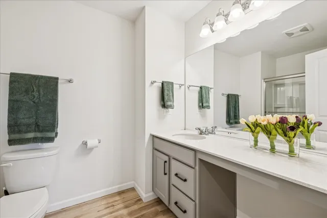 a bathroom with a sink a vanity and a mirror