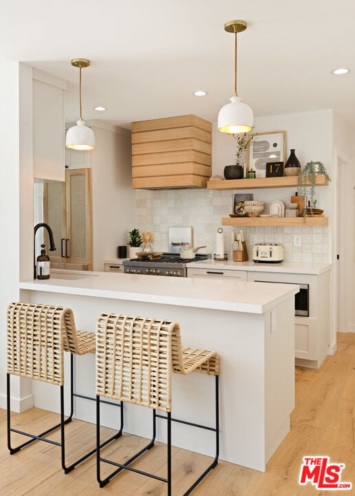 17 Sunset Avenue, Unit 1 Venice, CA 90291 - Photo 12 of 30 a kitchen with stainless steel appliances granite countertop a sink and a stove