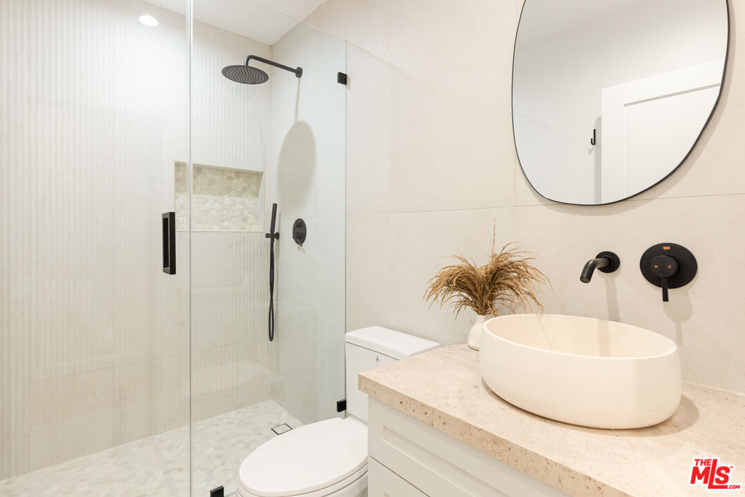 17 Sunset Avenue, Unit 1 Venice, CA 90291 - Photo 16 of 30 a bathroom with a sink toilet and shower