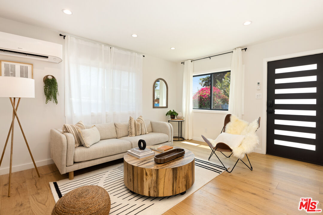 17 Sunset Avenue, Unit 1 Venice, CA 90291 - Photo 2 of 30 a living room with furniture and a window