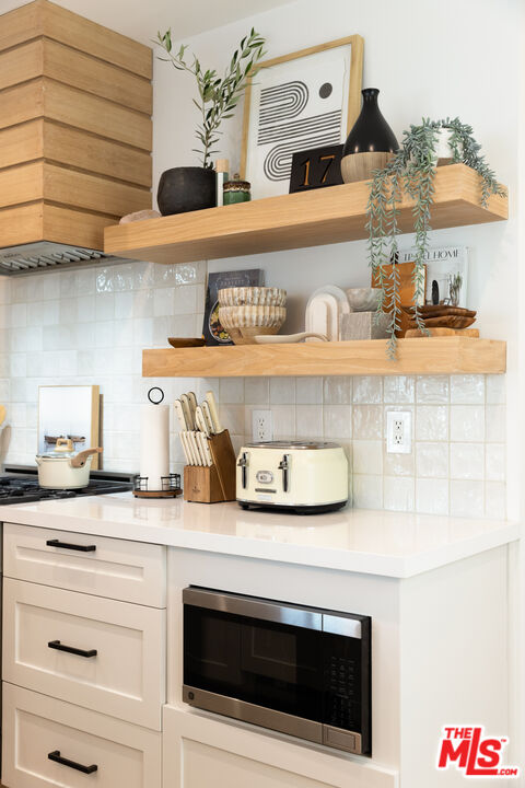 17 Sunset Avenue, Unit 1 Venice, CA 90291 - Photo 10 of 30 a kitchen with stainless steel appliances granite countertop a stove and a sink
