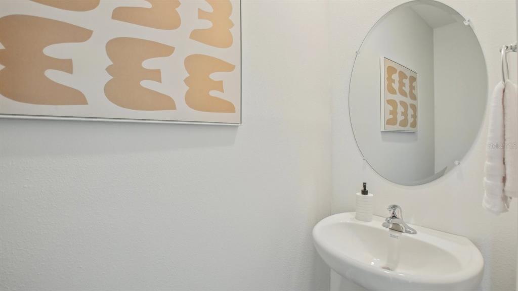 38370 Tea Rose Avenue Zephyrhills, FL 33540 - Photo 15 of 36 a bathroom with a sink and a mirror