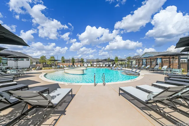 a view of a patio with swimming pool