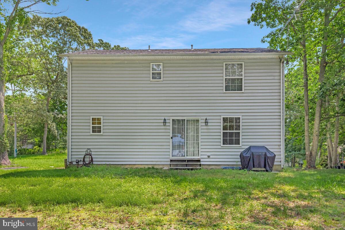 11423 Rawhide Road Lusby, MD 20657 - Photo 35 of 37 a view of a house with a backyard