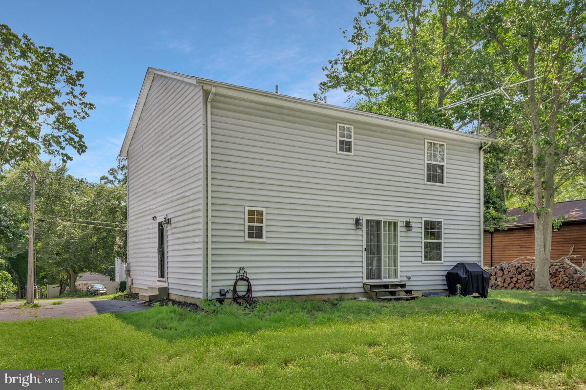 11423 Rawhide Road Lusby, MD 20657 - Photo 36 of 37 a view of a house with a backyard