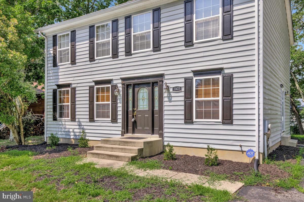 11423 Rawhide Road Lusby, MD 20657 - Photo 37 of 37 a front view of a house with a yard