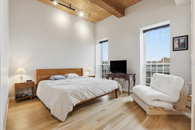 a bedroom with a bed and a couch