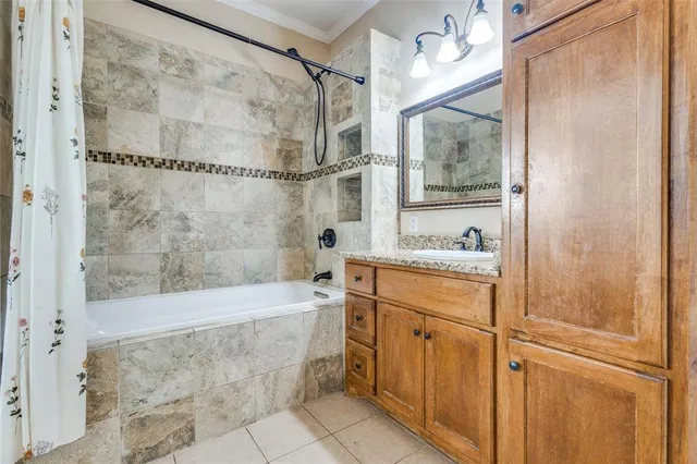 a bathroom with a granite countertop shower mirror and a sink