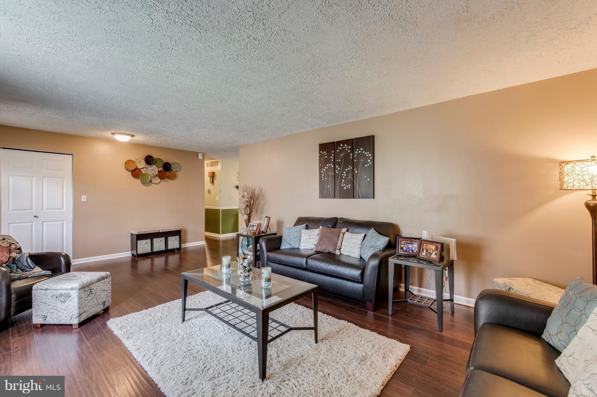 1519 National Road Baltimore, MD 21237 - Photo 2 of 30 a living room with furniture and wooden floor