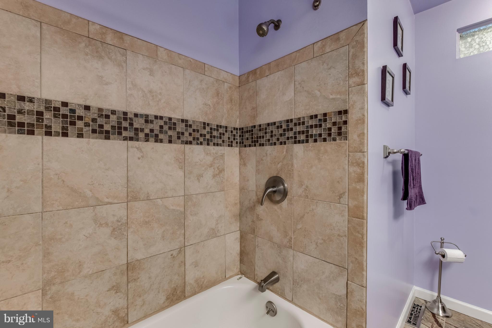 1519 National Road Baltimore, MD 21237 - Photo 13 of 30 a bathroom with a bathtub and shower