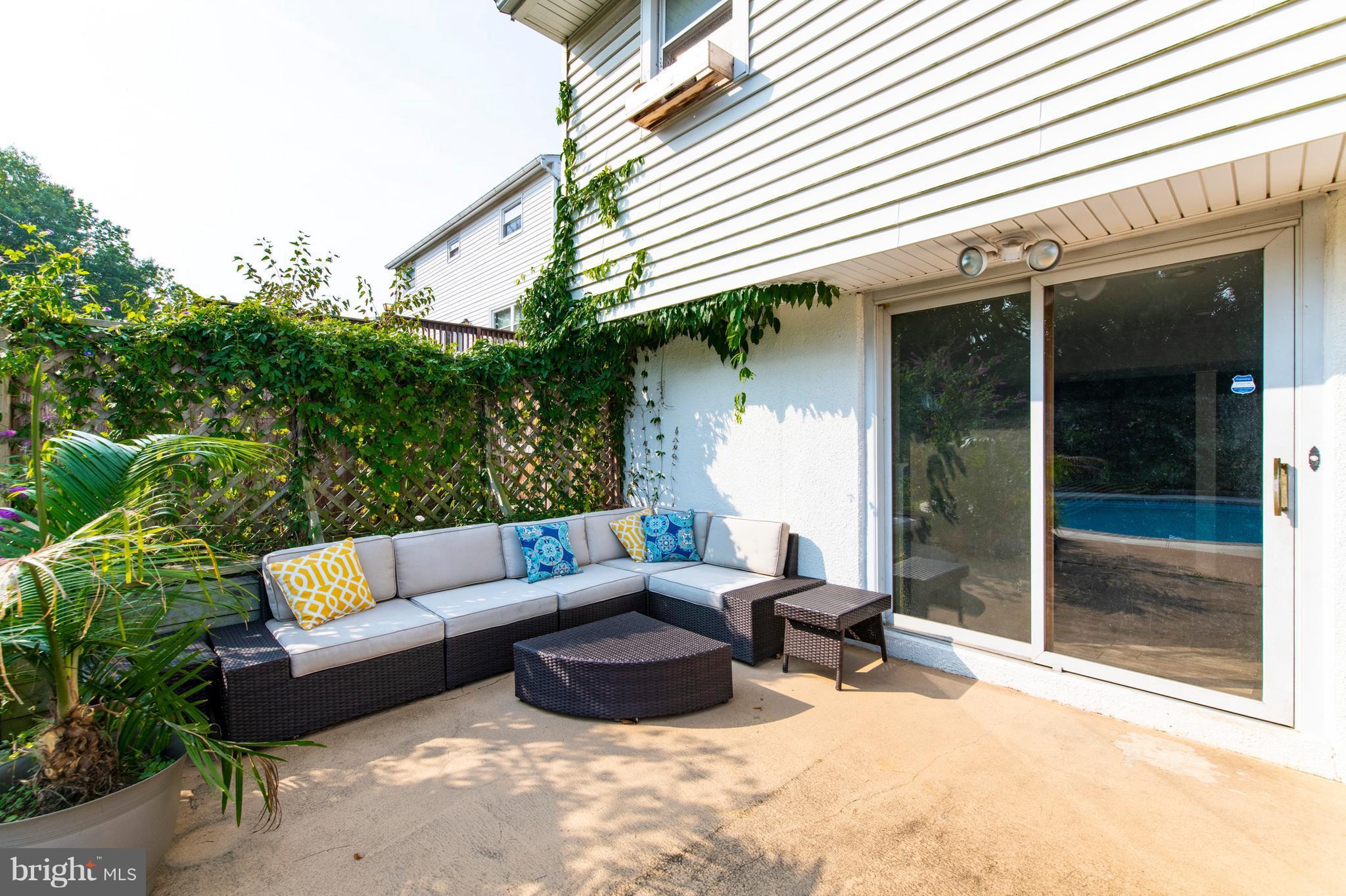 1519 National Road Baltimore, MD 21237 - Photo 22 of 30 a outdoor space with patio the couches and a potted plant on a table