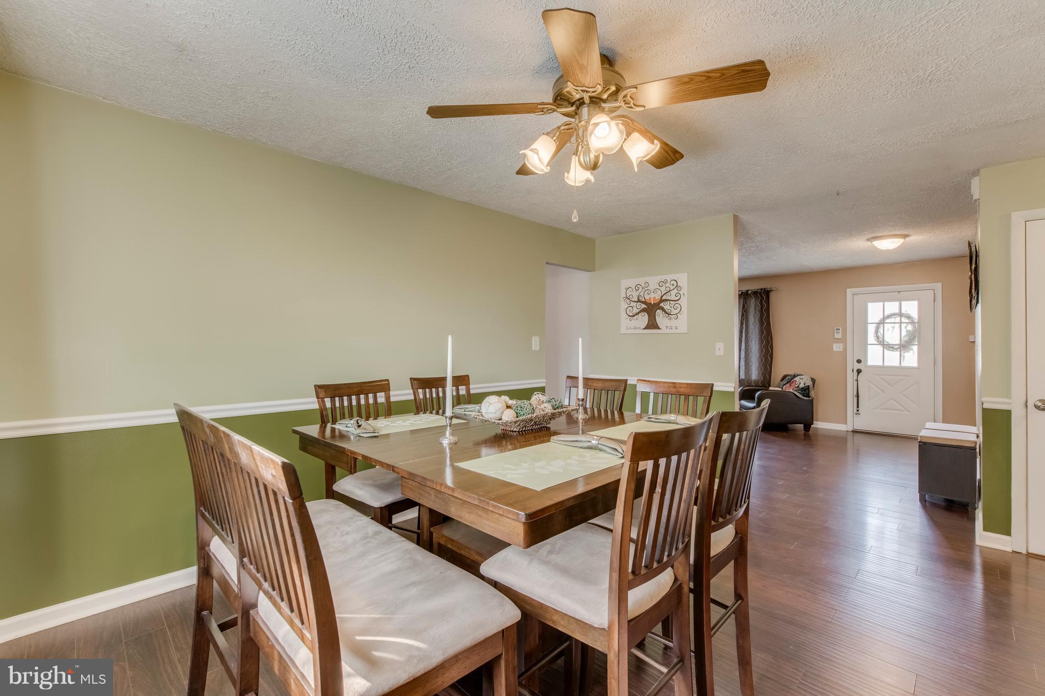 1519 National Road Baltimore, MD 21237 - Photo 4 of 30 a view of a dining room with furniture and wooden floor