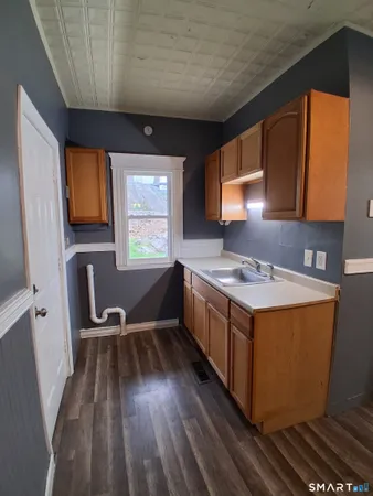 a utility room with sink washer and dryer