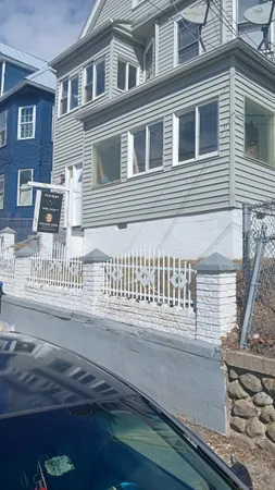 a view of a house with wooden deck