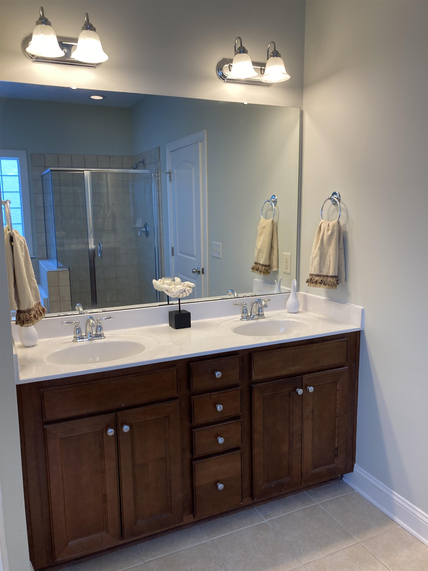 812 Historian Street Raleigh, NC 27603 - Photo 21 of 45 Primary bathroom with double vanity. Adjoining walk in closet . Enclosed water room with linen closet Primary onsuite