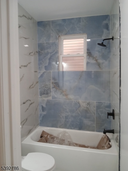14 Ruth Street Irvington, NJ 07111 - Photo 2 of 15 a bathroom with a shower and bathtub