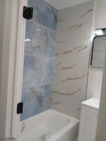 14 Ruth Street Irvington, NJ 07111 - Photo 8 of 15 a bathroom with a bathtub